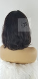 Sarai is 100% Human Hair Wavy Bob With Bangs perfect for all skin tones