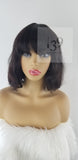 Sarai is 100% Human Hair Wavy Bob With Bangs perfect for all skin tones