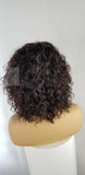 Sharon is a Sexy 100% Human Hair Water Wave Wig With Bangs