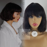 Sarai is 100% Human Hair Wavy Bob With Bangs perfect for all skin tones